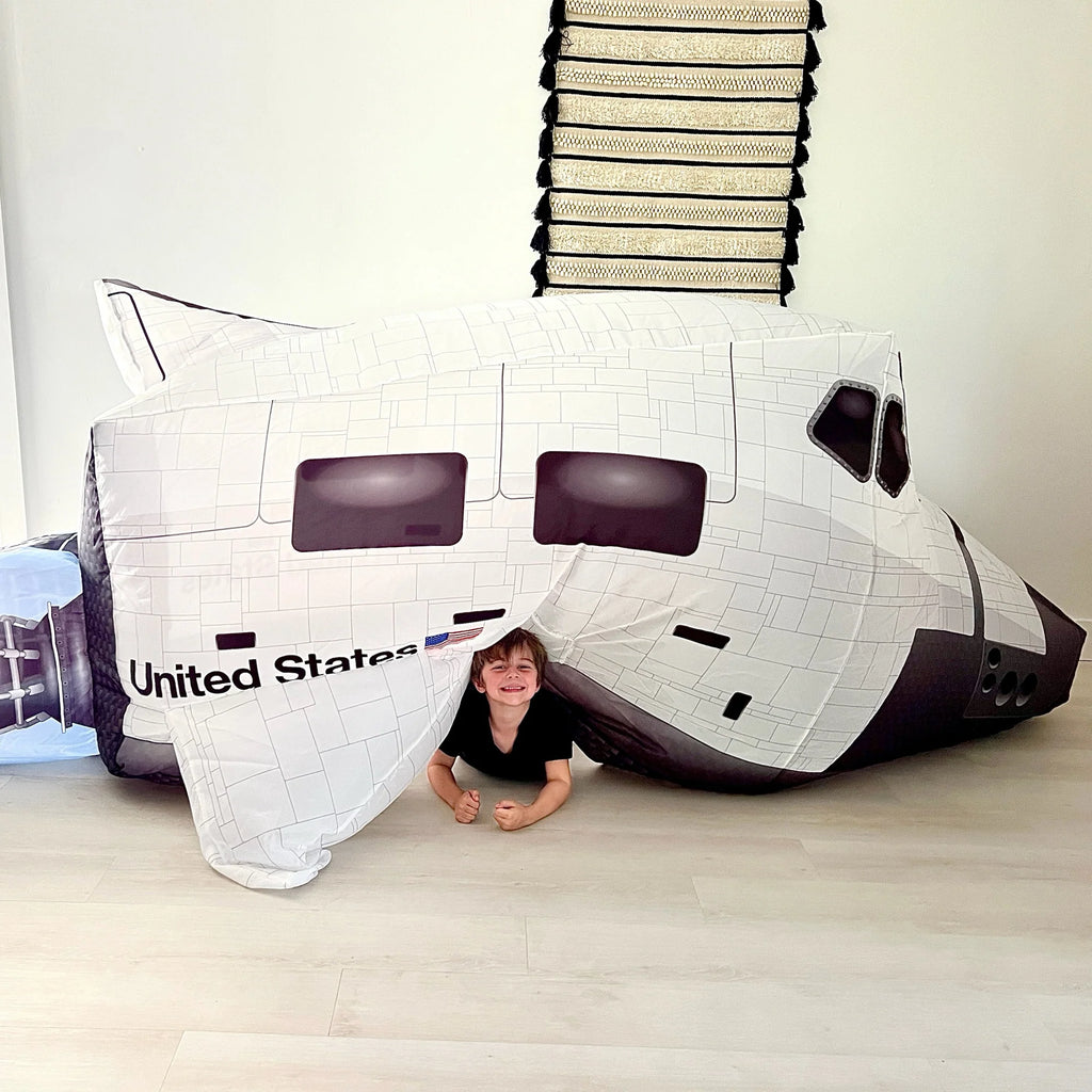 Image of child playing in an inflated AirFort Space Shuttle