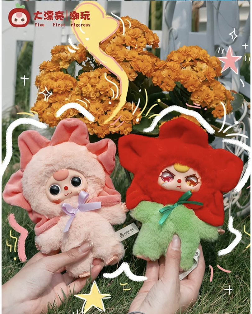 Two plush toys, one pink and one red, held by a person with decorative elements and brand logo.