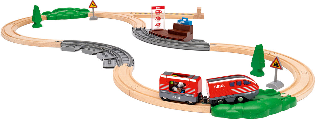 Toy train set with tracks and red train on a white background