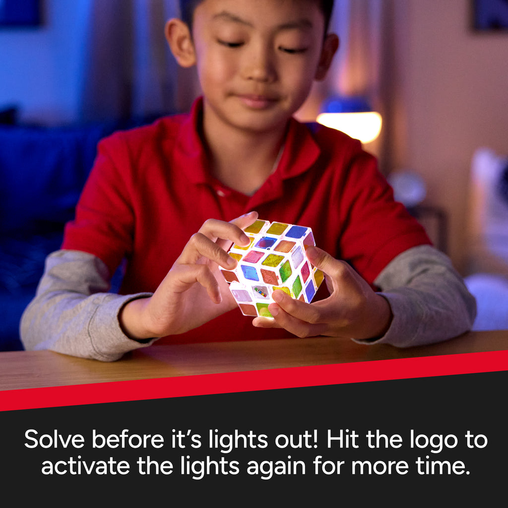 Child playing with a Rubik's cube in a cozy indoor setting