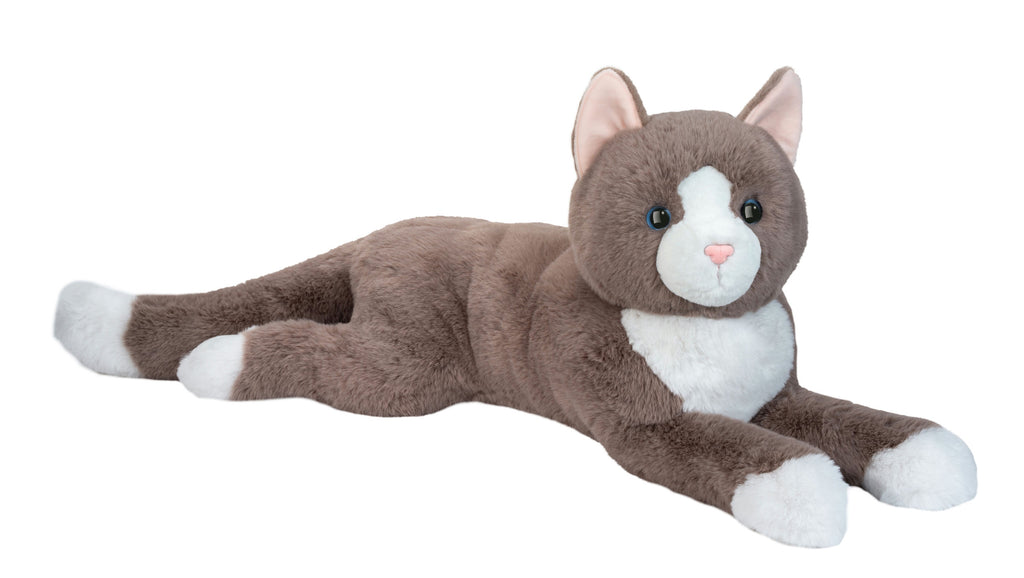 Plush toy cat lying down on a white background