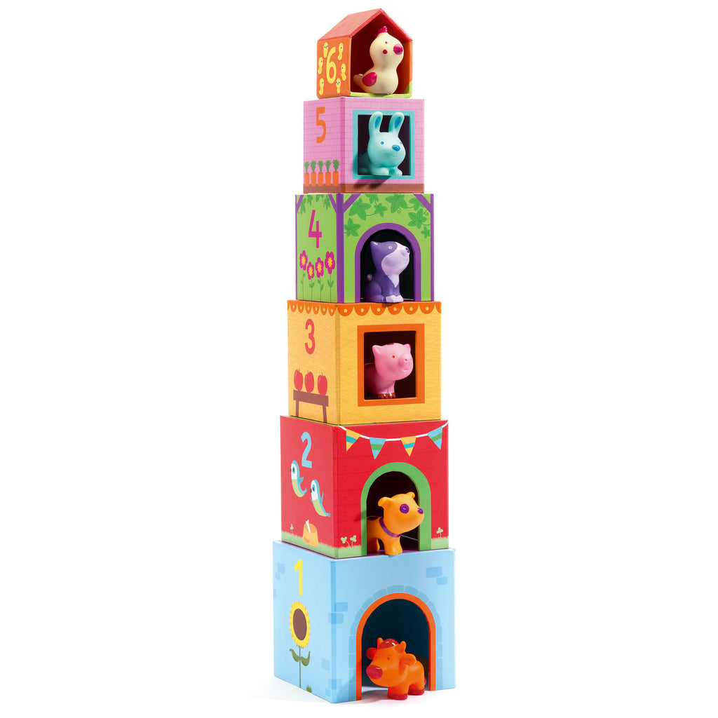 Stack of colorful toy blocks with animal figures on a white background