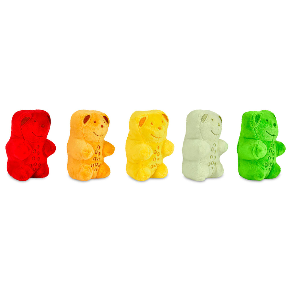 Five colorful gummy bear toys on a white background