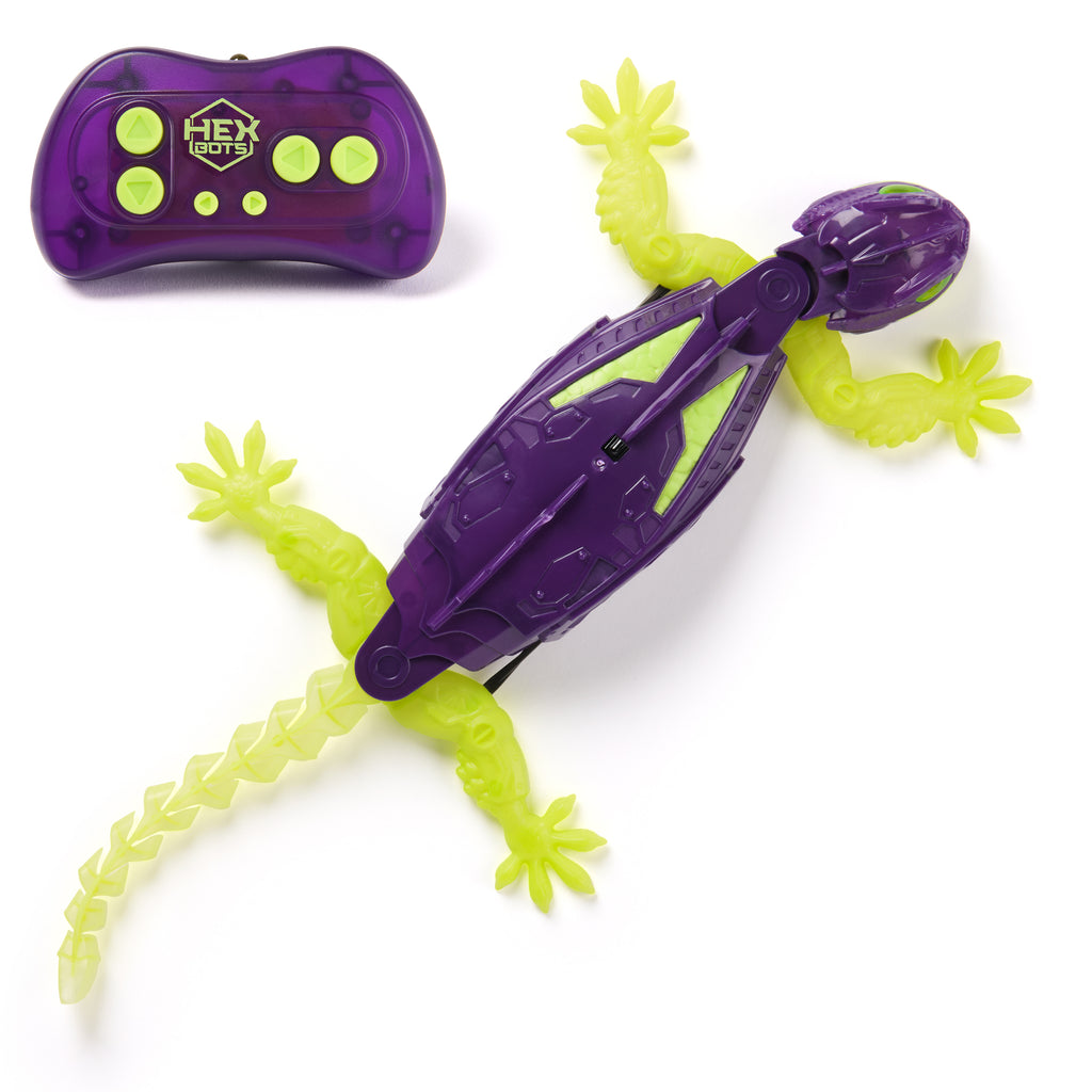 Purple and green remote control lizard toy on a white background