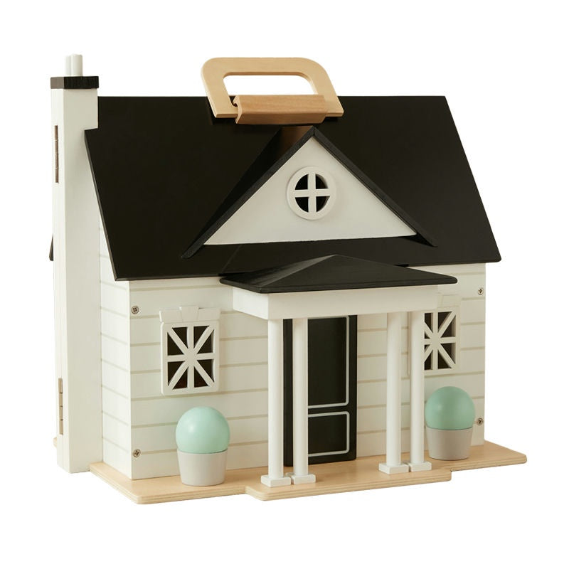 Small wooden house model with a black roof and white base on a white background