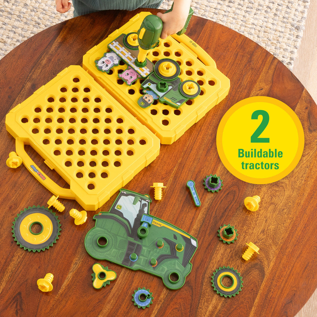 Toy building set with two buildable tractors on a wooden table