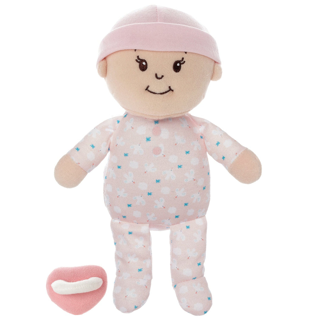 Plush baby doll with pink outfit and pacifier on a white background