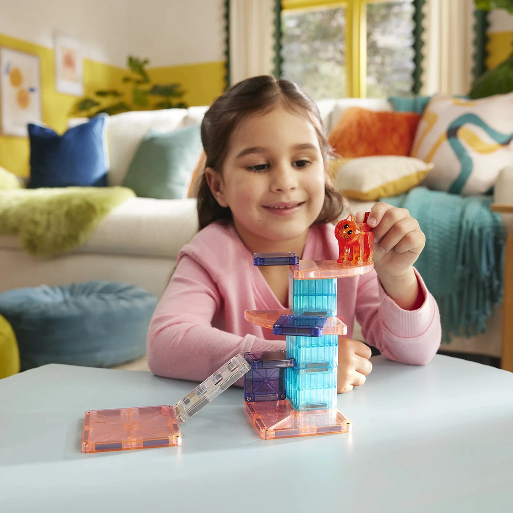 Young girl playing with building blocks in a cozy living room.