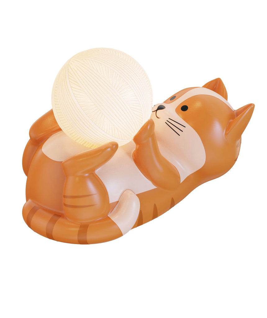 Cat-shaped night light with a glowing ball on a white background