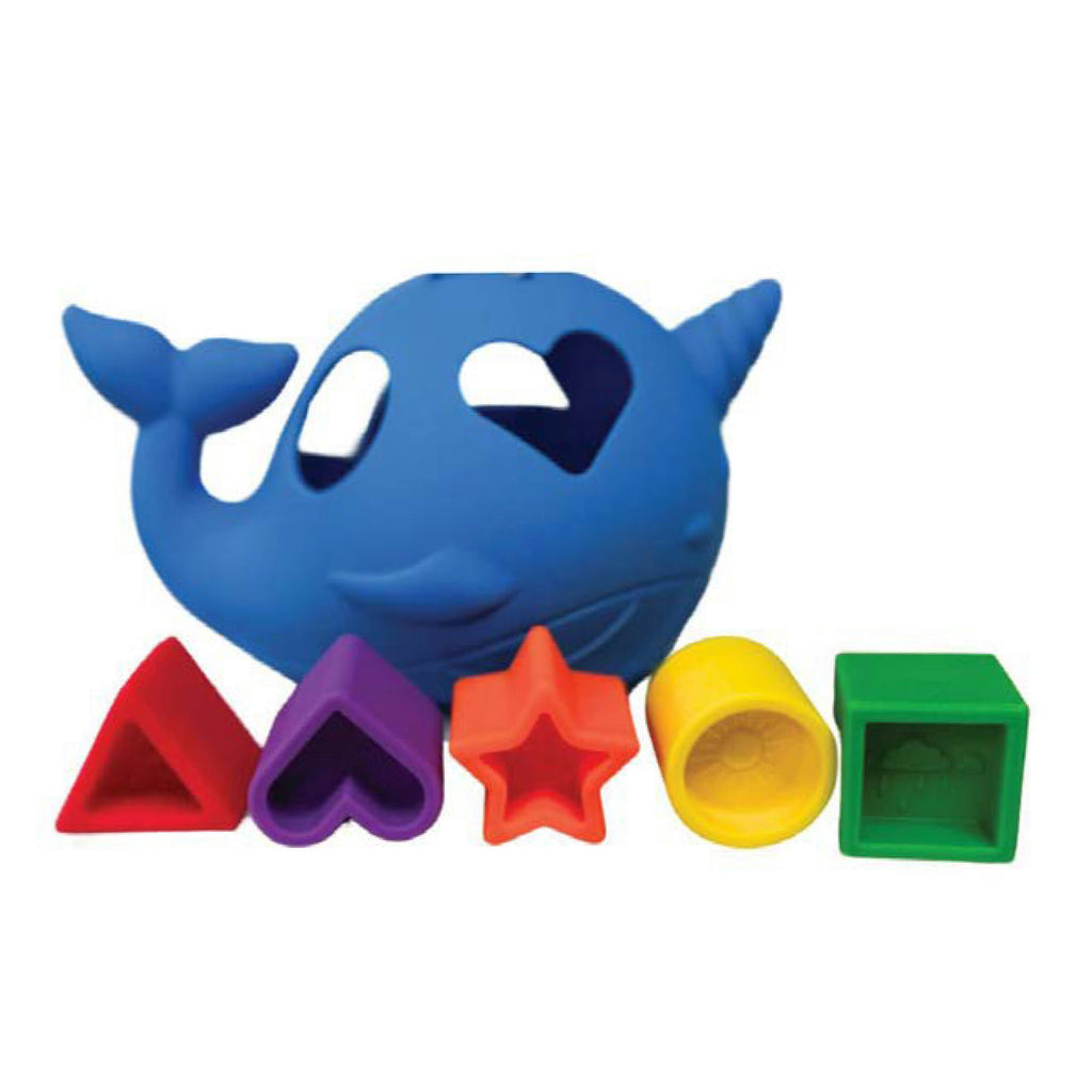 Blue narwhal-shaped toy with colorful geometric blocks on a white background