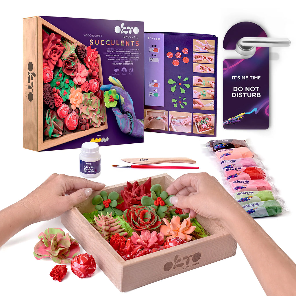 Wooden craft kit with colorful succulent designs, packaging, and tools on a white background.