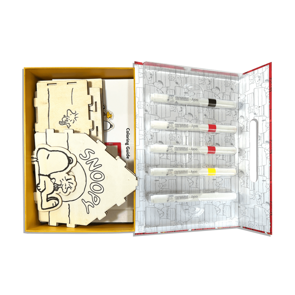Peanuts-themed coloring set with wooden sides, markers, and coloring guide in a box