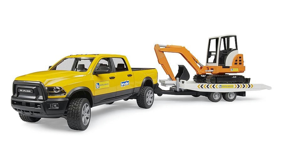 Yellow toy truck with a trailer carrying an excavator on a white background