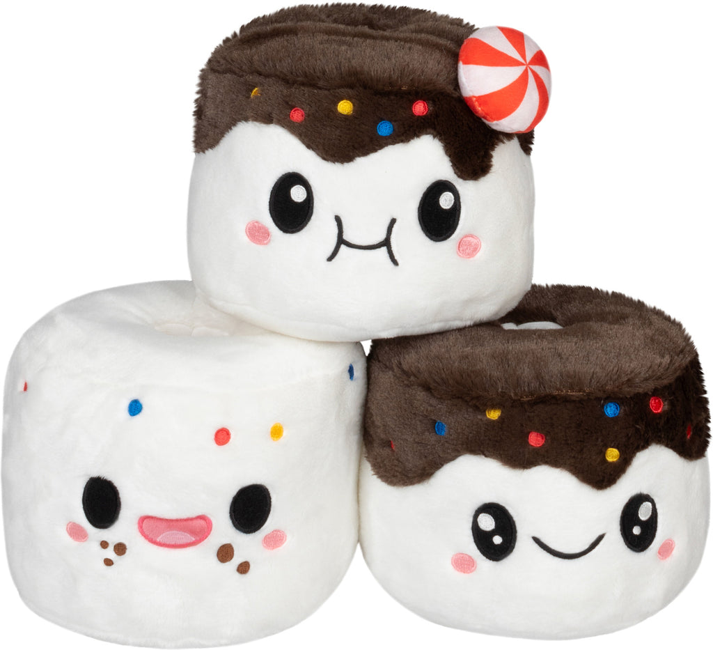 Plush toys resembling marshmallows with faces and toppings on a white background