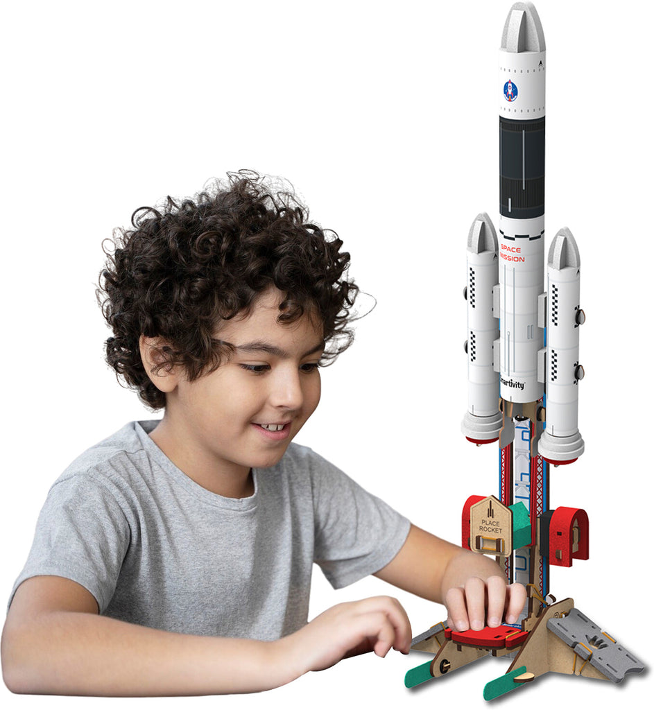 Child playing with a toy rocket model on a white background