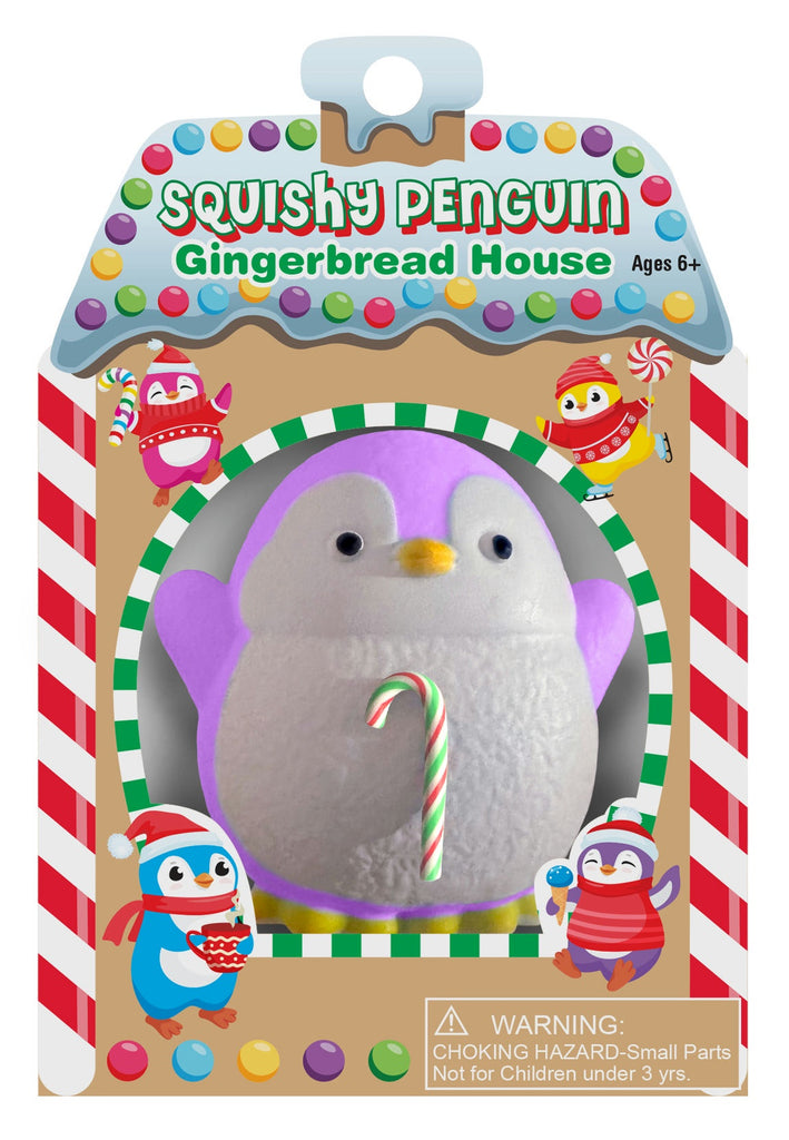 Squishy penguin gingerbread house toy in packaging with colorful decorations