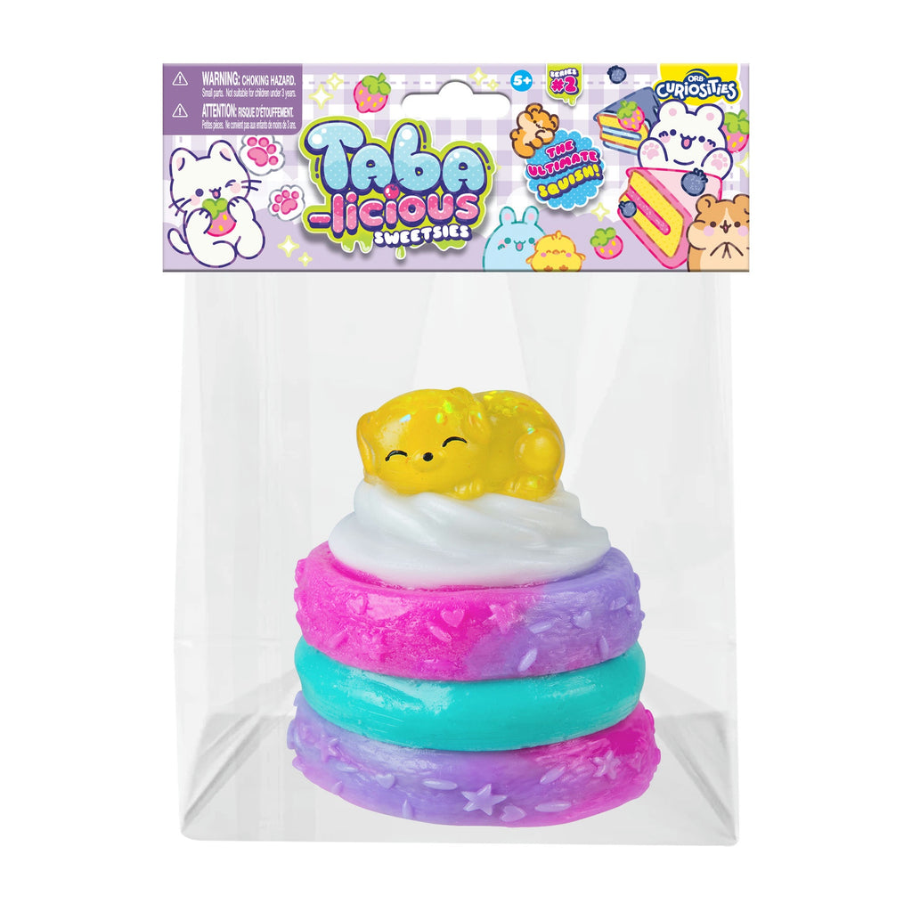 Stack of colorful rings with a yellow puppy on top on a white background, featuring Taba-licious branding.