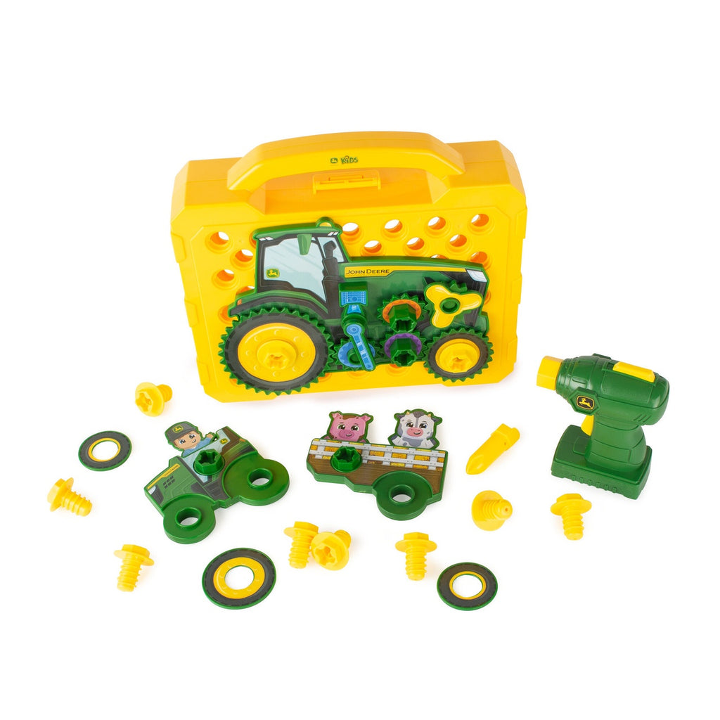 Toy construction set with a yellow toolbox, green tractor, and various tools on a white background