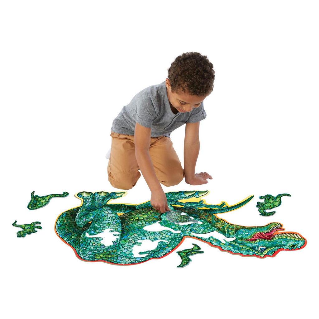 Image of child playing with Shiny Dinosaur Floor Puzzle by Peaceable Kingdom