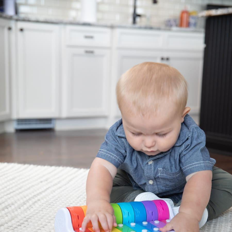 Image of child playing with Rock N' Roller Piano from Fat Brain Toys