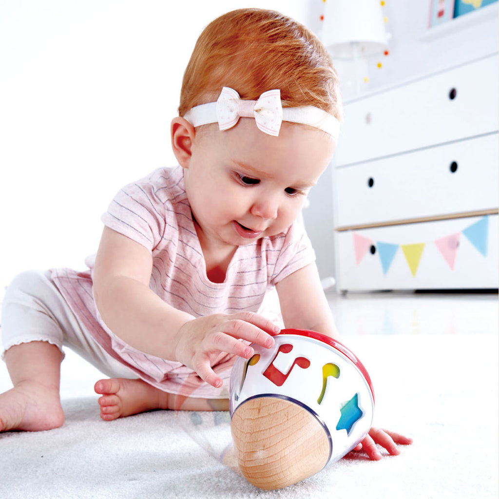 Image of child playing with Rotating Music Box from Hape